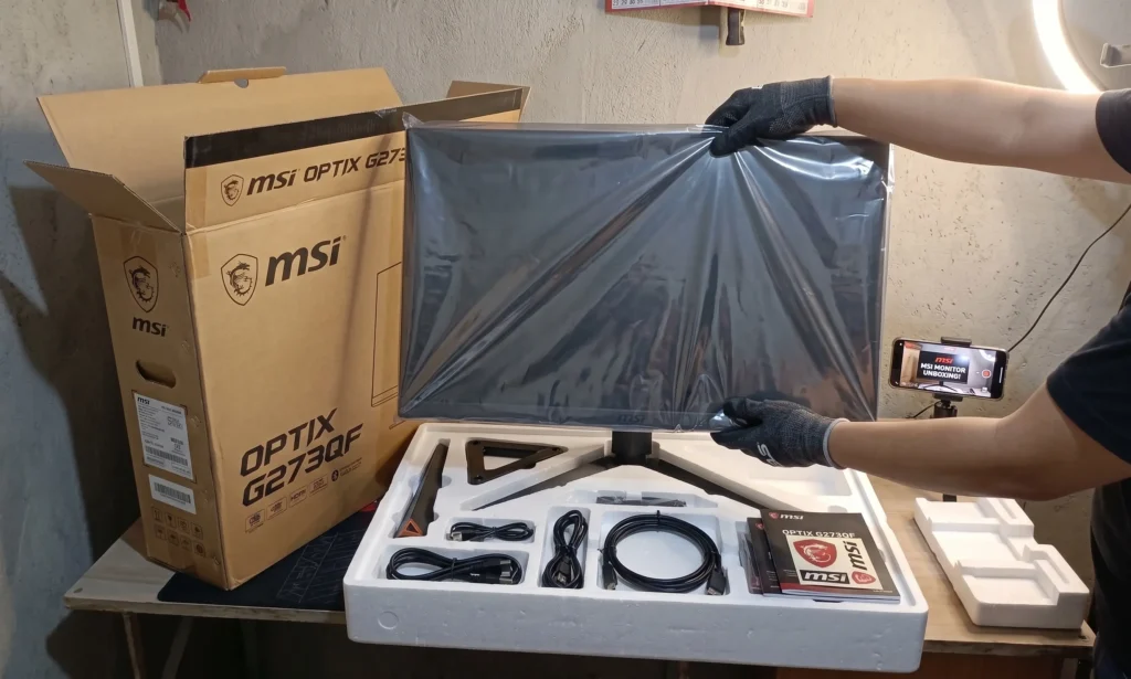 MSI PRO MP225 budget monitor unboxing showing box contents and cables