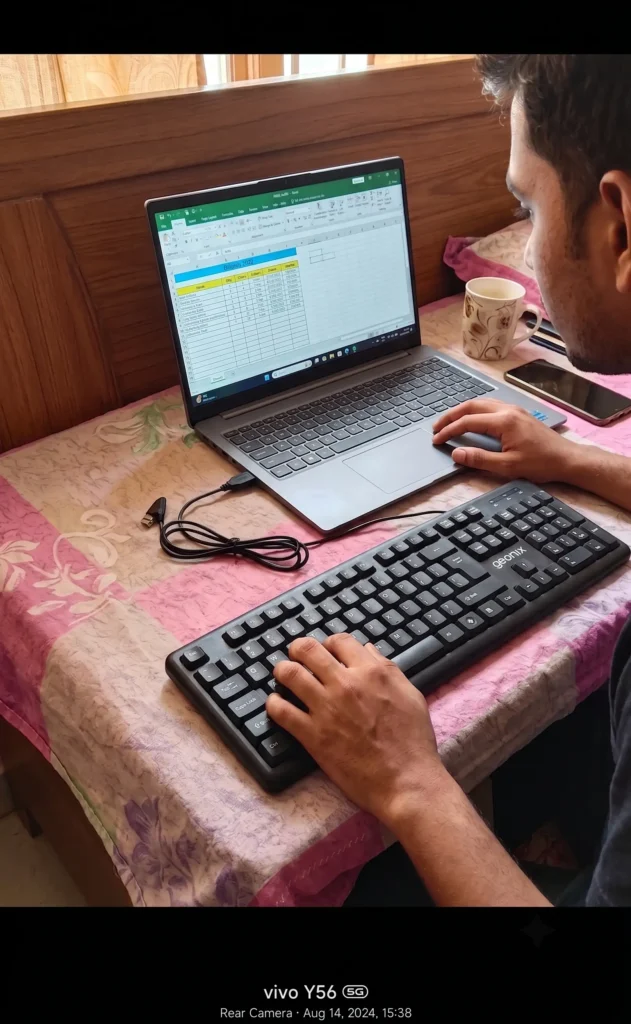 User typing on Geonix Wired Essential USB Standard Laptop Keyboard for work